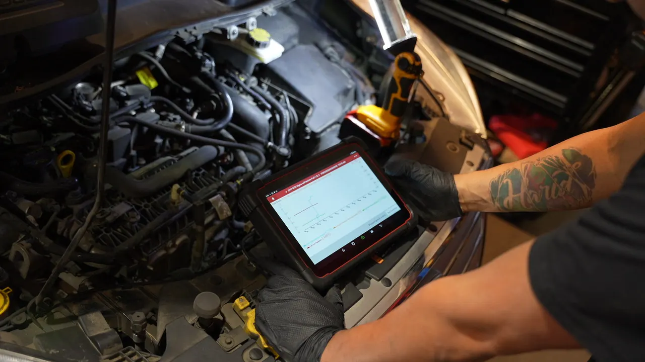 Computer diagnostics on an engine at Mr. Memo Auto