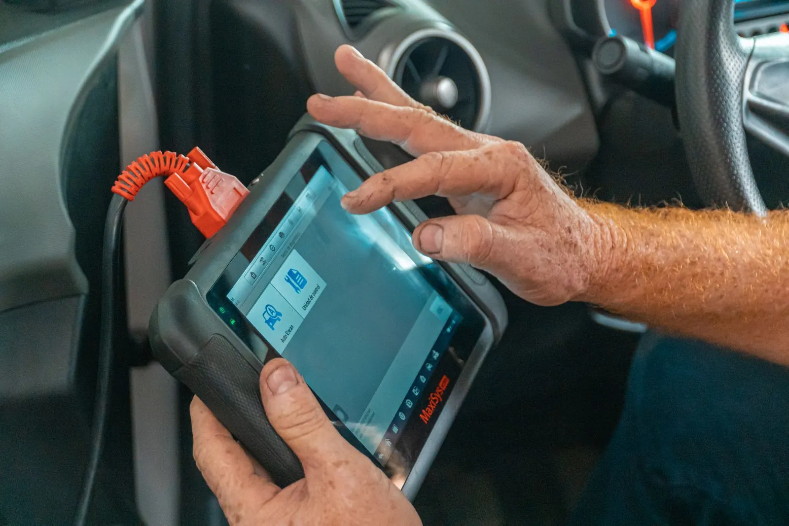 Diagnostic scan tool plugged into a car