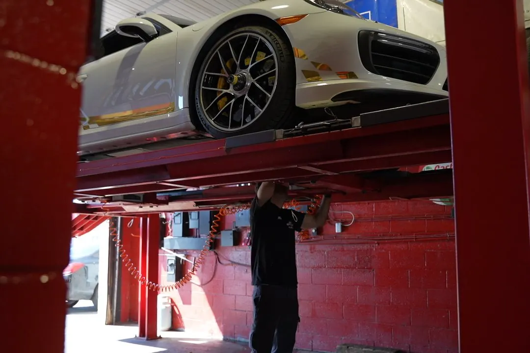 Vehicle raised on a lift in our shop